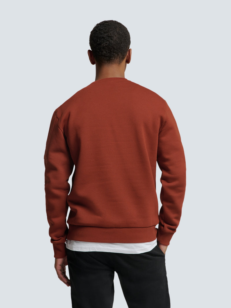 Sweater with Rubber Logo Patch and Zippered Arm Pocket | Rusty