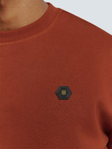 Sweater with Rubber Logo Patch and Zippered Arm Pocket | Rusty